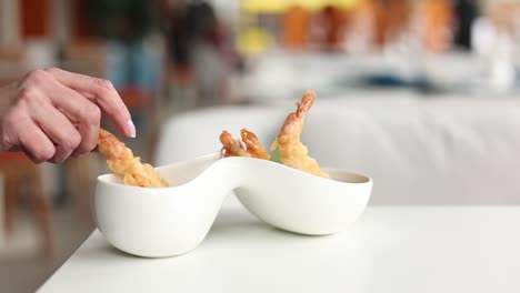 woman eating delicious tempura shrimp