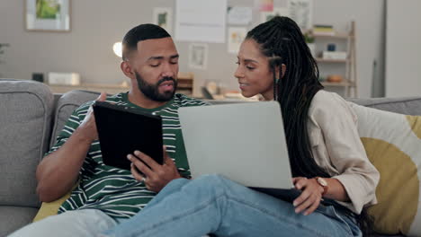 Couple,-sofa-and-tablet-or-laptop-for-planning