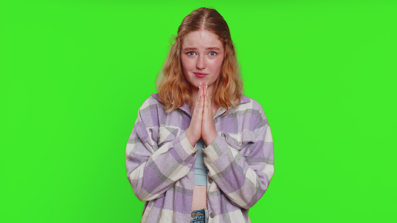 Caucasian sad woman praying making wish, asking hopeful help, begging apology, meditation, imploring
