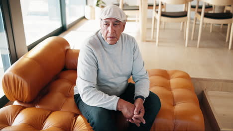 senior man sitting on a couch