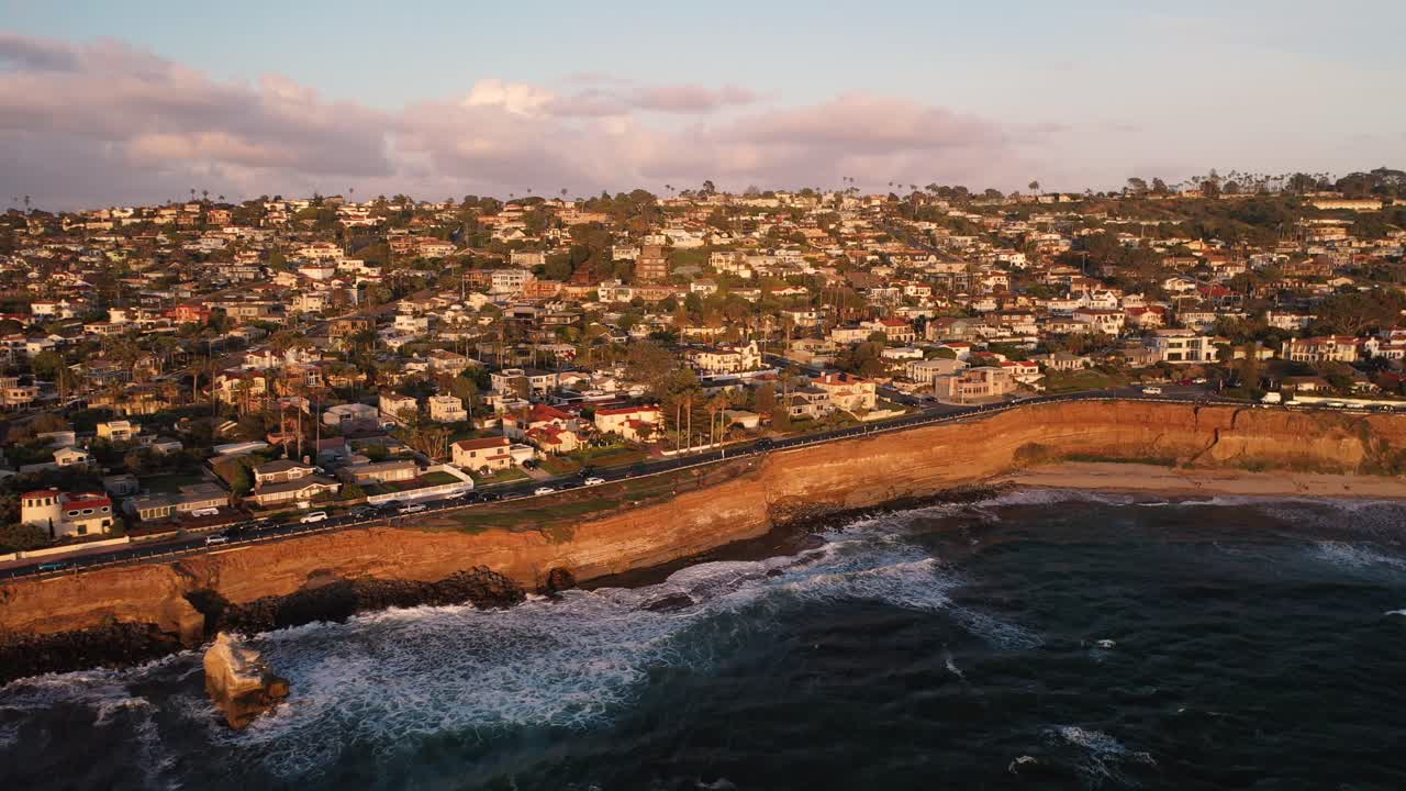 Aerial pan of bluffs and homes at Sunset Cliffs in San Diego