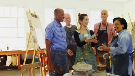 woman assisting artists in pottery 4k