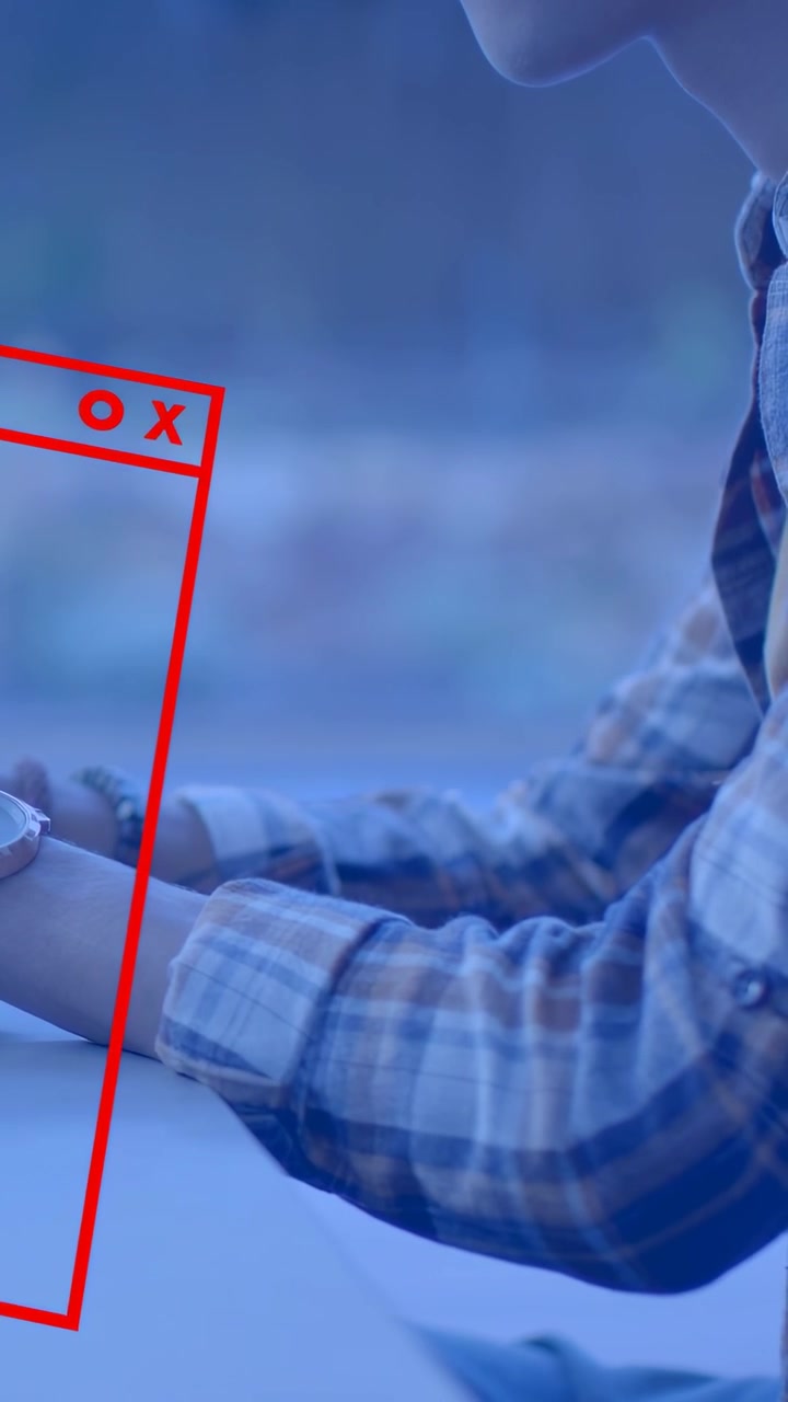 Vertical video: Man at table tapping device, causing red UI window forming breaking cycling for UX