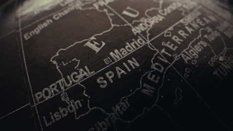 close-up of a vintage world globe map, highlighting spain and portugal
