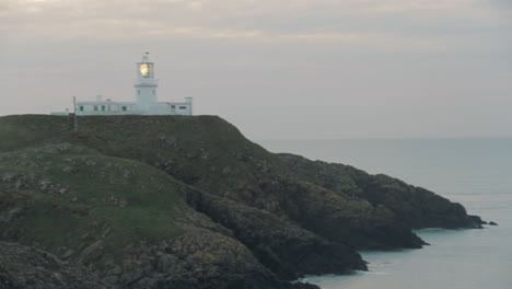 view of lighthouse on cloudy evening