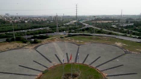 4k high resolution aerial drone video view of the flower highway interchange with israeli flags- rishon lezion- israel