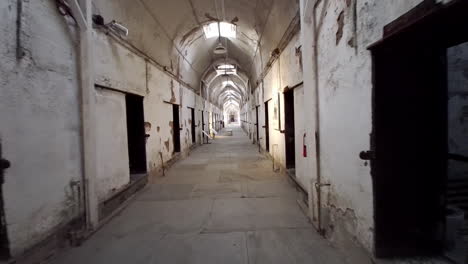 moving shot of prison corridor past cells at eastern state penitentiary