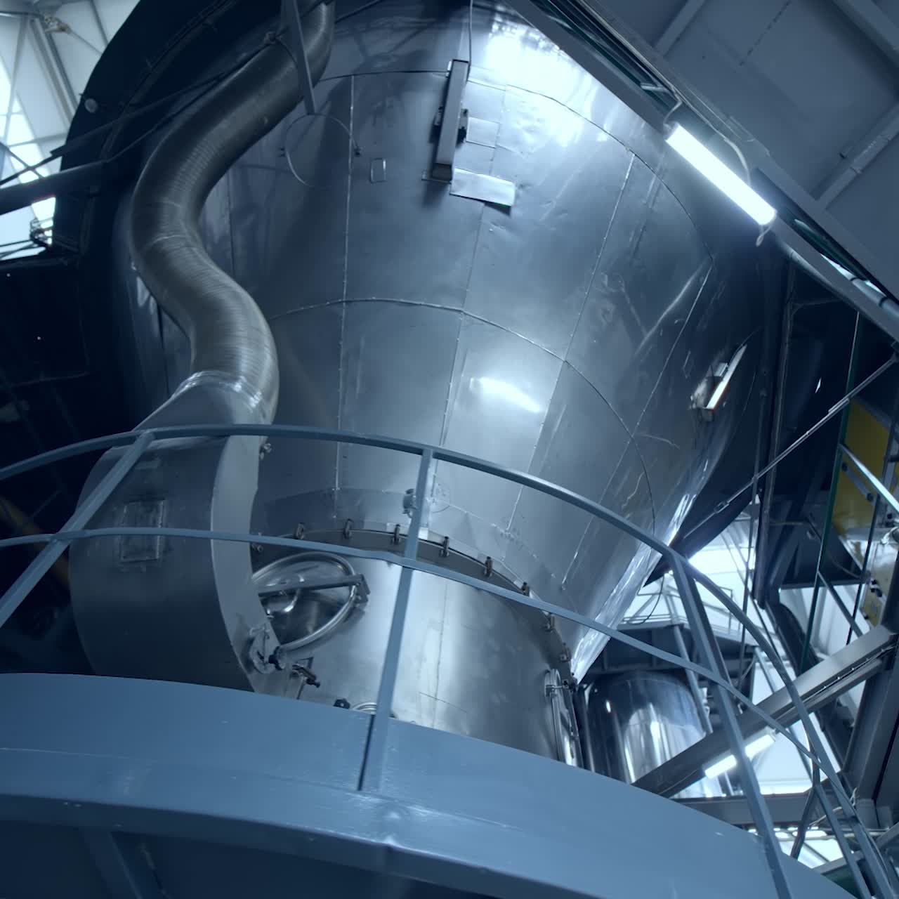 Interior of dairy factory with fermentation tank. Technology equipment at dairy farm. Sterile production