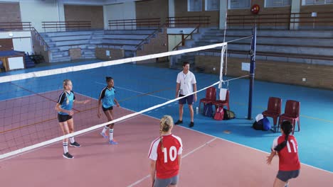 female players playing volleyball in the court 4k