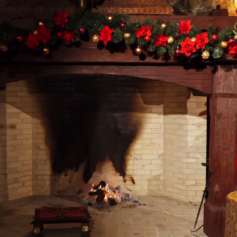 festive cozy fireplace. new year's design background near the fireplace. christmas decorations inside the room with pleasant mantel. warm home mood.