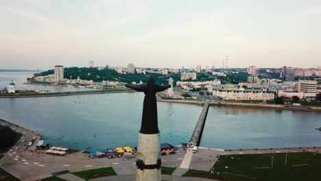 aerial view of mother patroness and water river in cheboksary, russia during evening