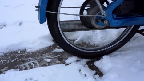 retro moped making wheel spin on ice