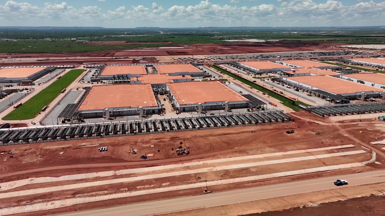 4K aerial drone video of the Stargate data center construction site in Abilene, Texas, showing AI infrastructure, site preparation, graded land, access roads, and construction progress.
