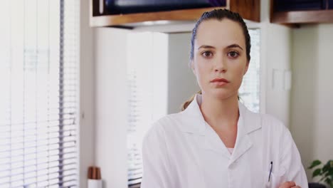 female physiotherapist standing with arms crossed in clinic 4k