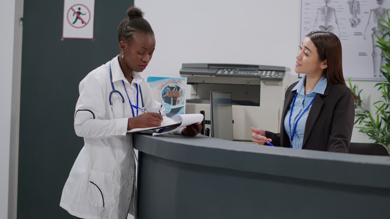 Doctor and Receptionist at Hospital Reception Desk