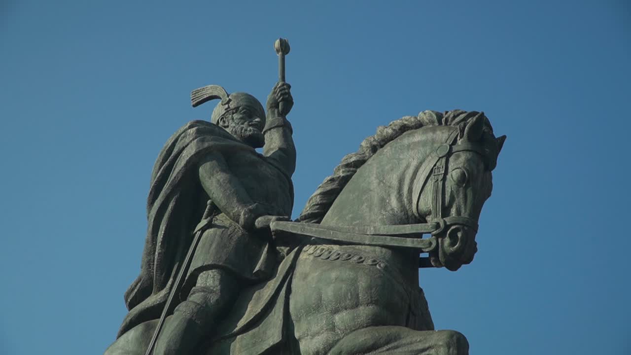 Closeup View Of The Equestrian Statue Of Michael The Brave In Alba Iulia, Transylvania, Romania Under The Clear Blue Sky On A Sunny Day - Tilt Down Shot
