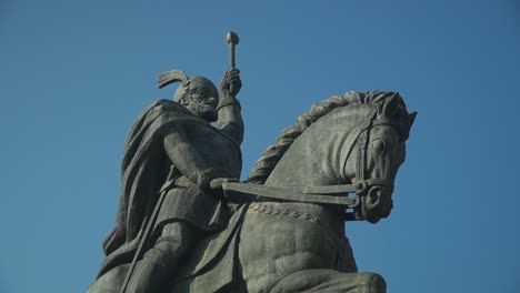 closeup view of the equestrian statue of michael the brave in alba iulia, transylvania, romania under the clear blue sky on a sunny day - tilt down shot