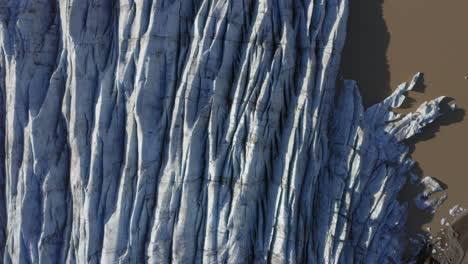 Aerial:-Top-down-view-of-Svinafellsjokull-glacier-in-Iceland-during-a-sunny-day