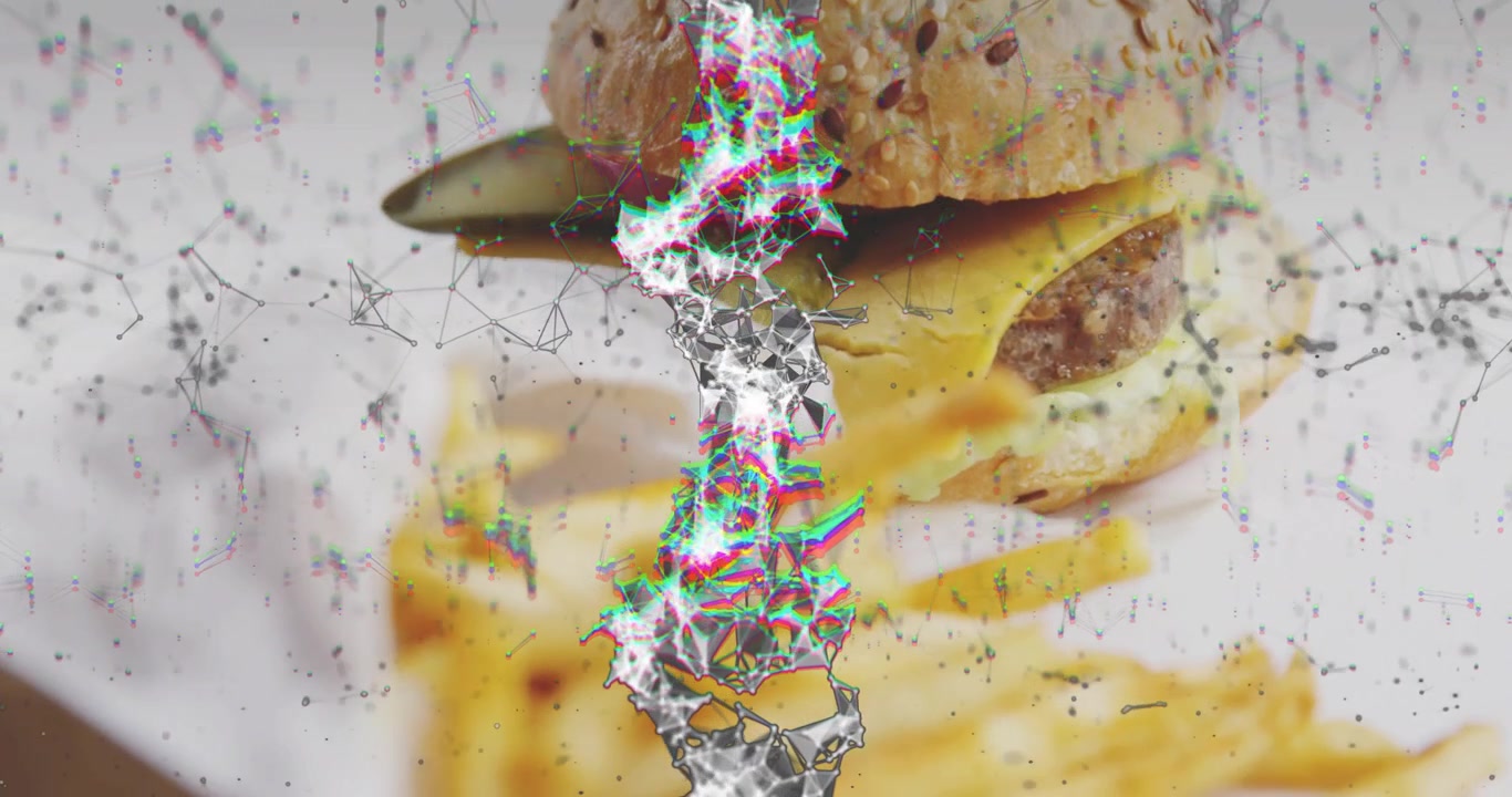 Seeded-bun cheeseburger sitting on liner, particle column appearing and revealing fries for food