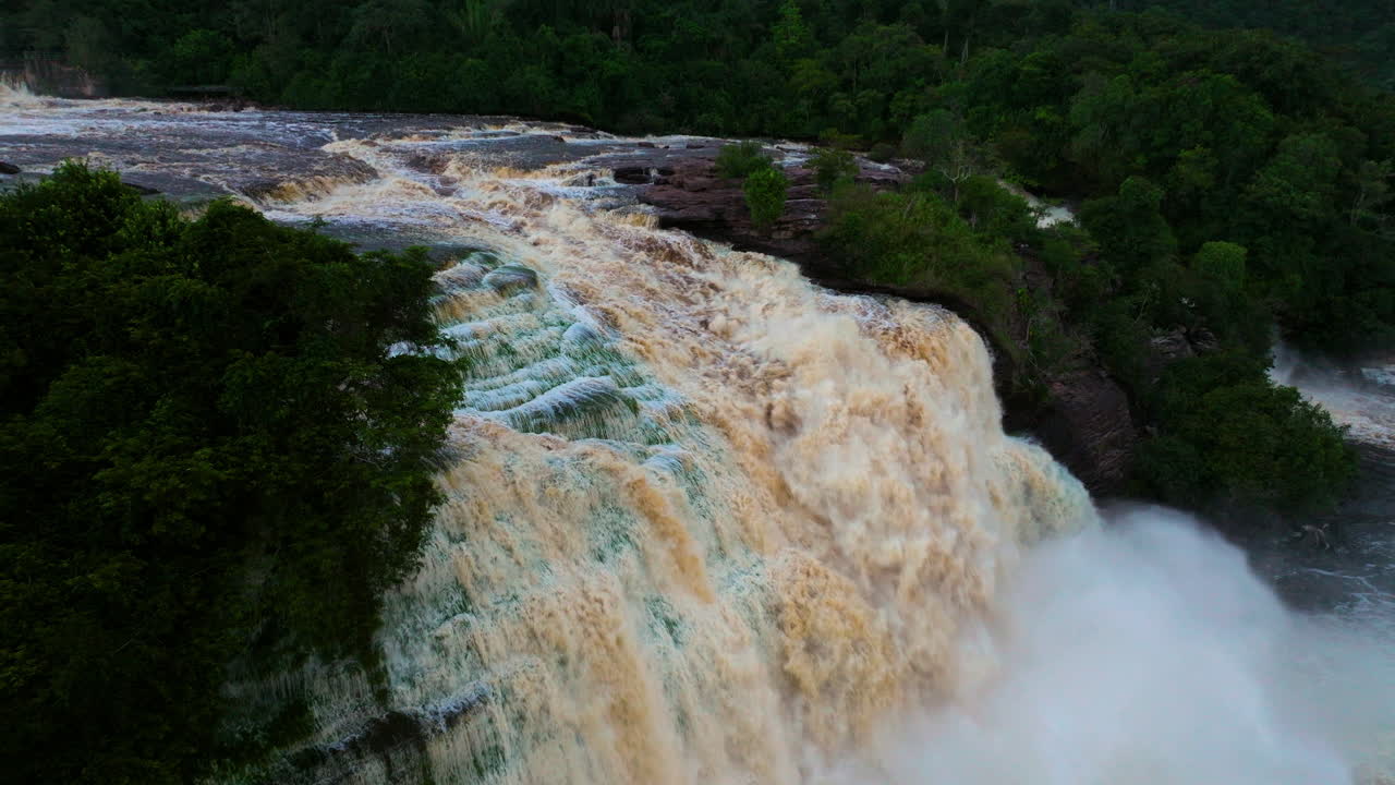 Powerful Waterfall Cascading Through a Lush Forest