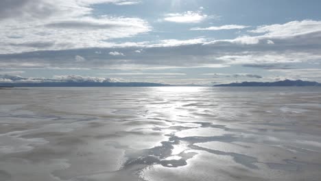 Aerial-orbit-over-Great-Salt-Lake,-Utah-on-a-sunny-spring-day