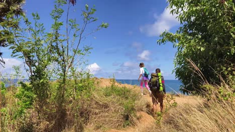 couple hiking on coastal trail