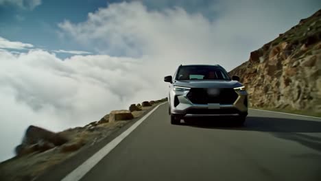 a sleek suv maneuvers along a winding mountain road, surrounded by stunning landscapes and vibrant clouds. the adventure unfolds in a breathtaking setting, showcasing nature's beauty.