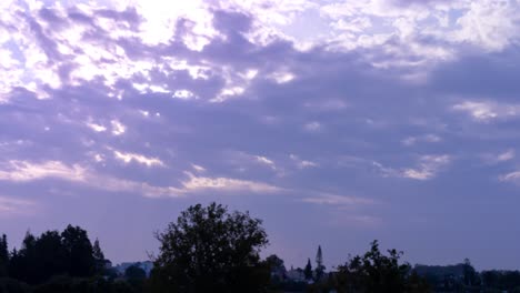 4k time lapse of morning sunrise behind clouds, beautiful purple-pink hue, shot in marbella, malaga, spain