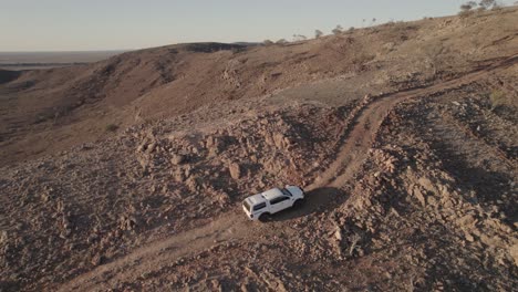 climbing a rugged hill in outback australia in a four-wheel-drive vehicle