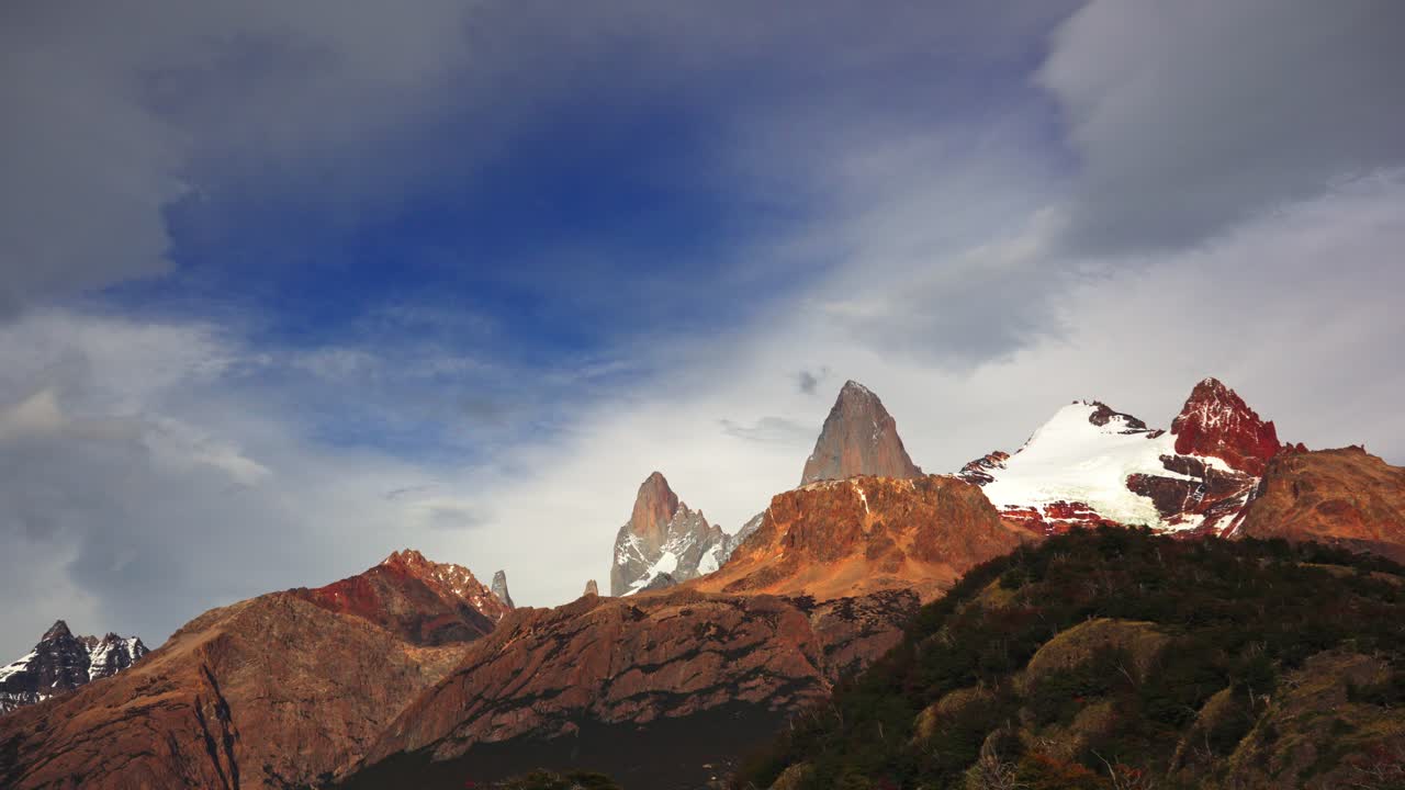 Time-lapse video of Mount Fitz Roy in Patagonia showing mountains with clouds moving across the sky with morning light highlighting the scenic natural beauty of the region