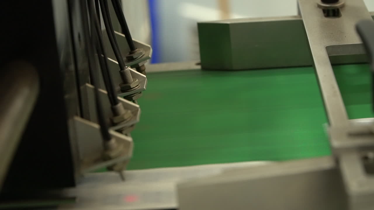 Pharma lab assembly line of drug pills finished on green treadmill, static