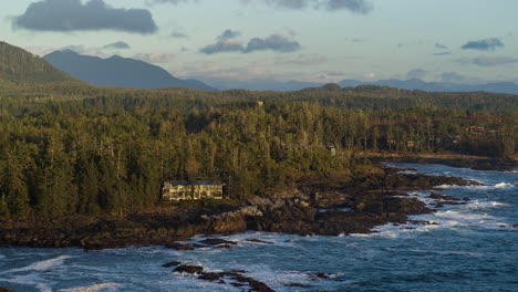 drone video at sunset in ucluelet british columbia, canada over the ocean and forest