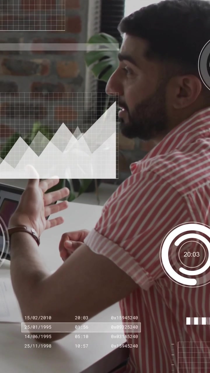 Vertical video: Man tapping tablet and gesturing in business, causing HUD charts for data review