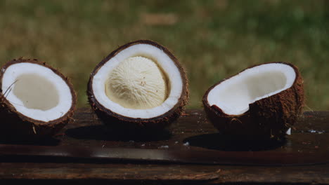 coconut halves on wooden table