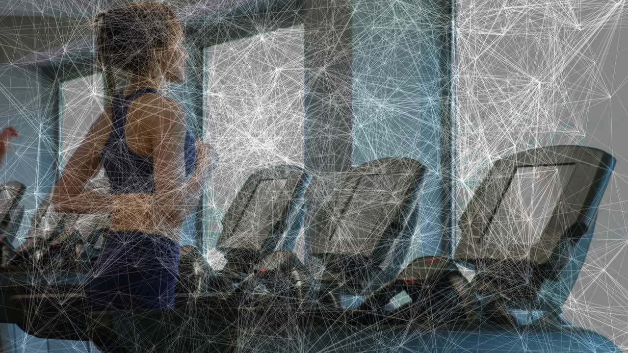 Two women starting workout on adjacent treadmills in gym, running steadily to maintain fitness