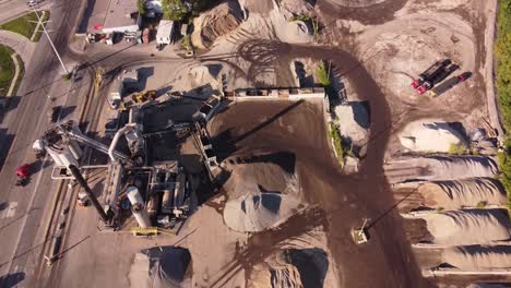 equipment and materials for producing asphalt in detroit, michigan - aerial drone