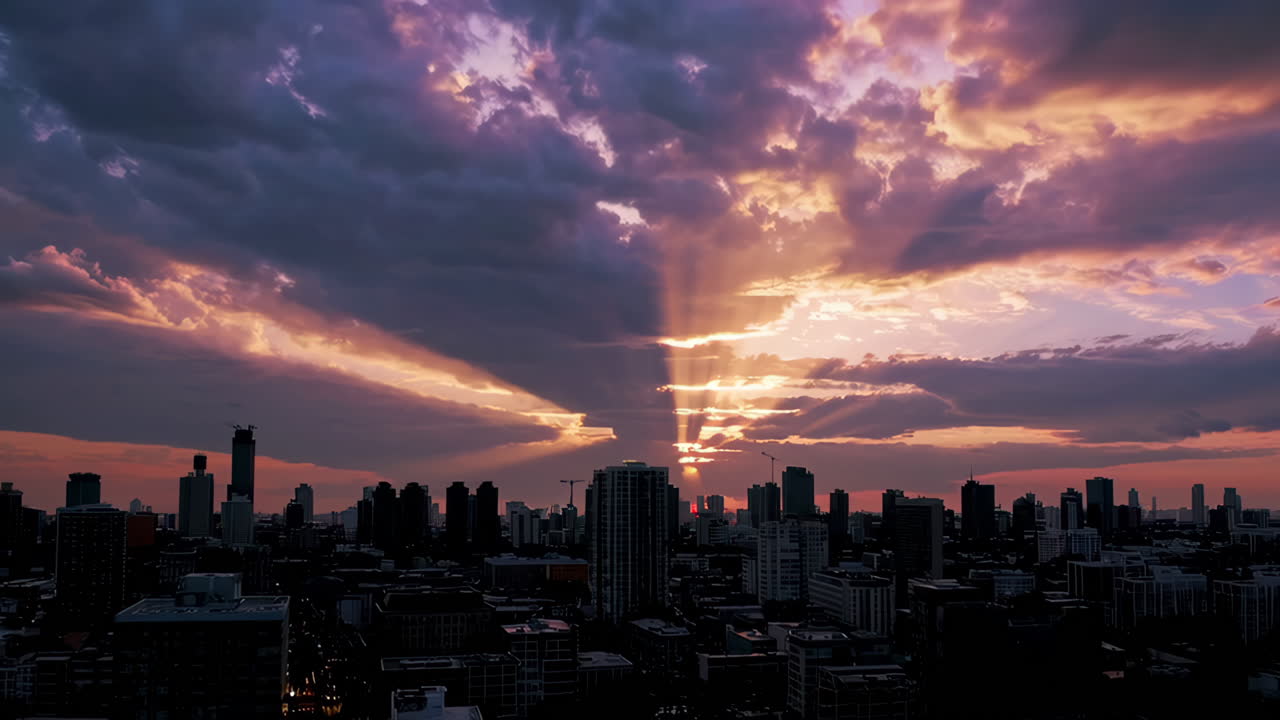 Dramatic Sunset Over City Skyline with Sun Rays