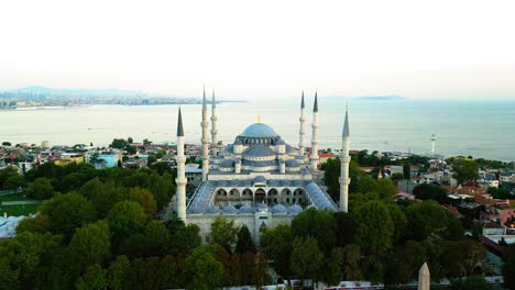 cinematic establishing aerial drone view of the blue mosque in at golden hour in istanbul, turkey