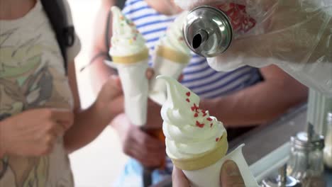 people enjoying ice cream cones