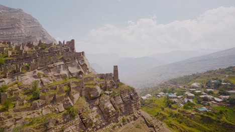 ancient cliffside ruins in a mountain valley