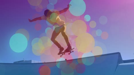 animation of spots of light over caucasian man on skateboard