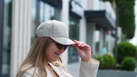 woman wearing a hat and sunglasses