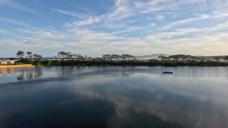 time-lapse of a serene lake with reflections