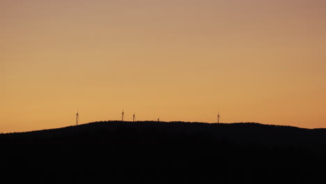 wind power generator turbines, at a sunny evening dusk, in hoga kusten, vasternorrland, sweden