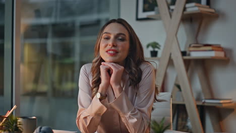 night employee finishing work in dark office. closeup smiling woman closing