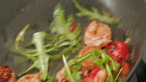 cooking shrimp with arugula and tomatoes