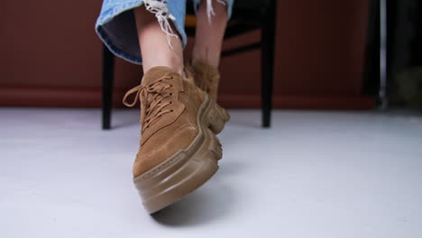 woman wearing brown platform shoes