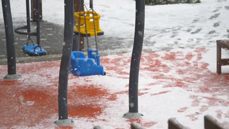 empty playground in the snow