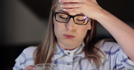 Closeup-Of-Exhausted-Businesswoman-Drinking-Coffee