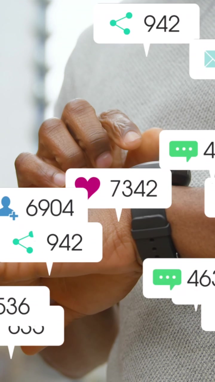 Animation of social media icons floating over mid section of a man using smartwatch outdoors